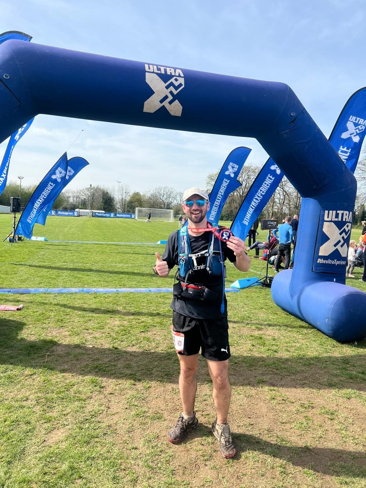 Jake Aston at the finish line of his ultra marathon