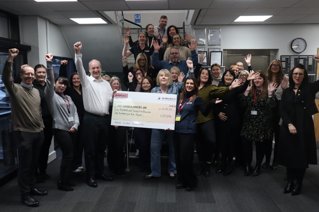 The Briggs Equipment team hand over a cheque for £125,104 to our 2024 charity partner, Air Ambulances UK