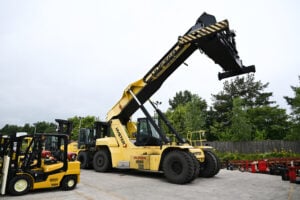 A used Hyster telehandler with it's mast extended.