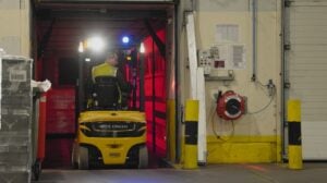 An electric counterbalance forklift at Whyte & Mackay's warehouse.