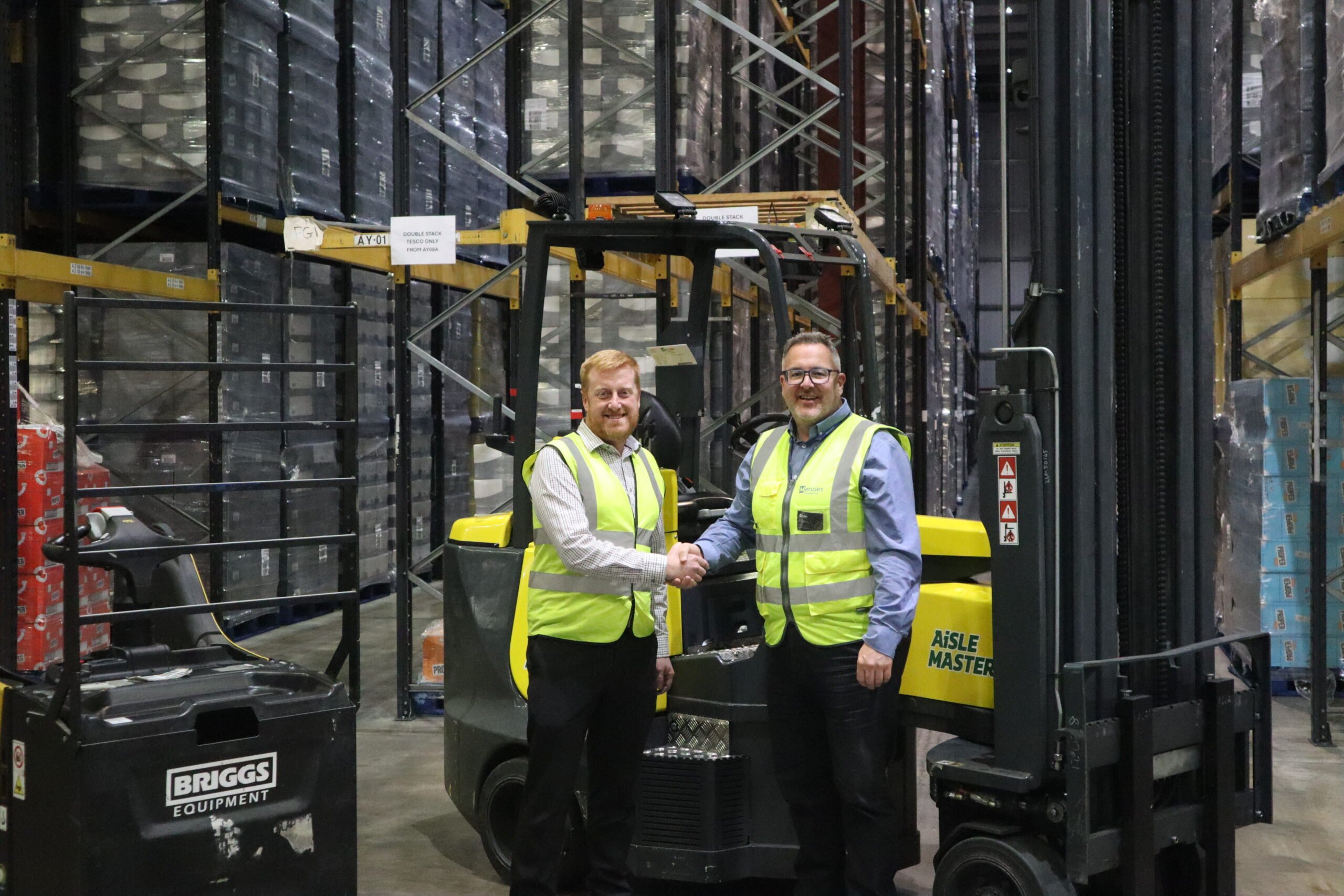 Gary Shaw and Adam Purshall complete the deal to extend the sole supplier agreement between Menzies Distribution Solutions and Briggs Equipment.