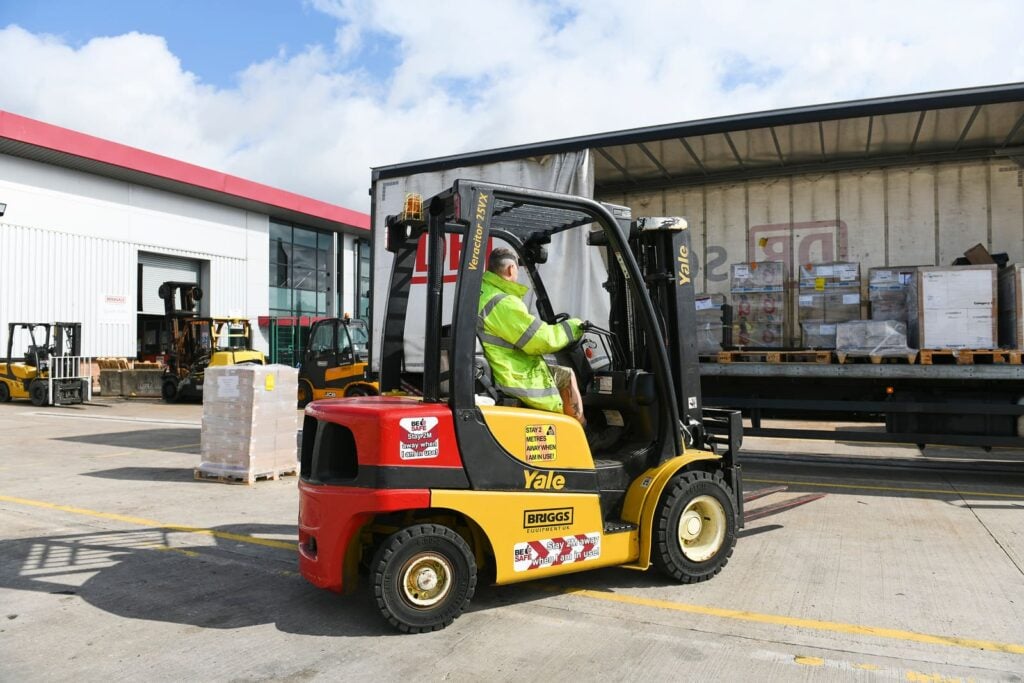 Forklift being used to load the back of a lorry