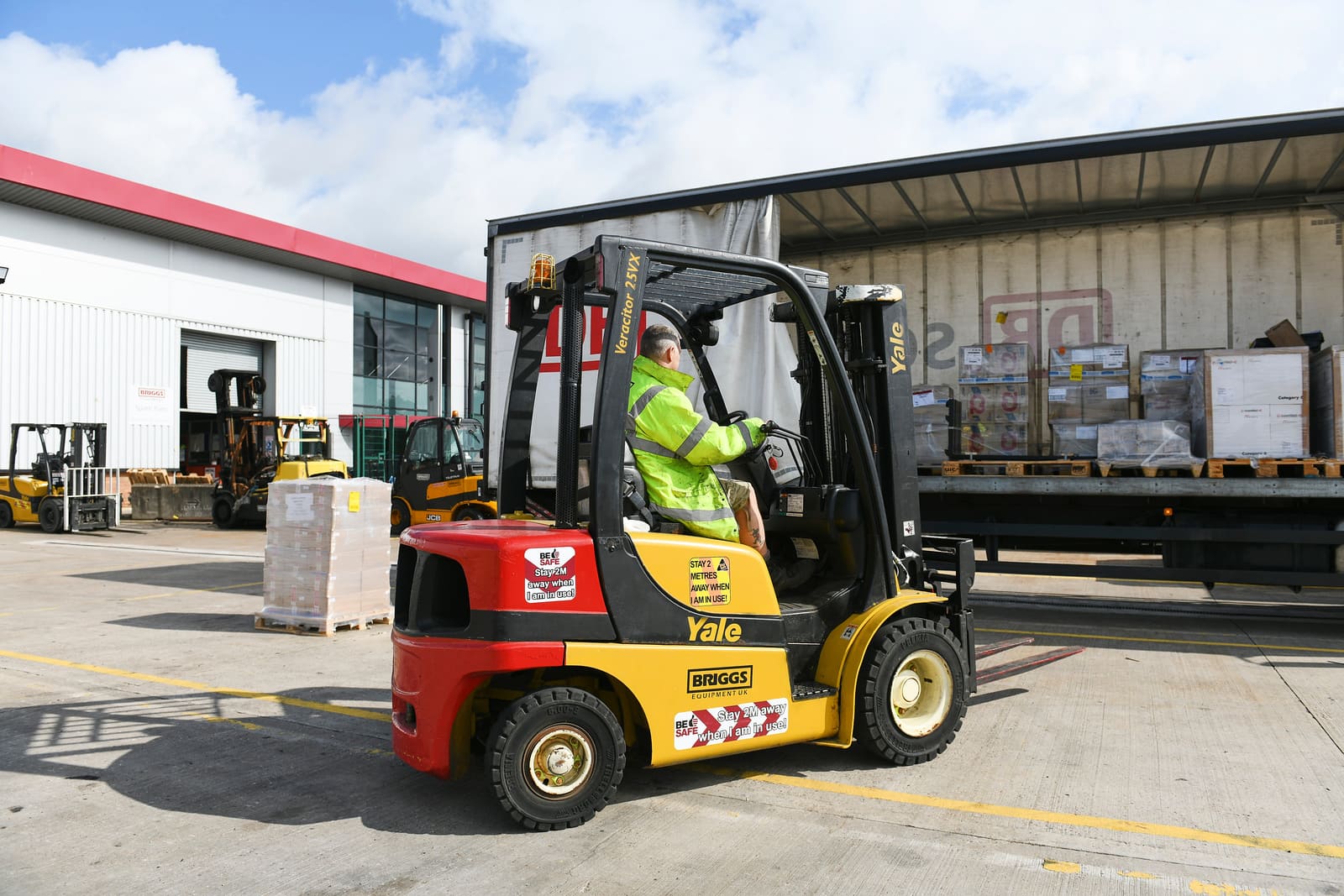 Forklift being used to load the back of a lorry