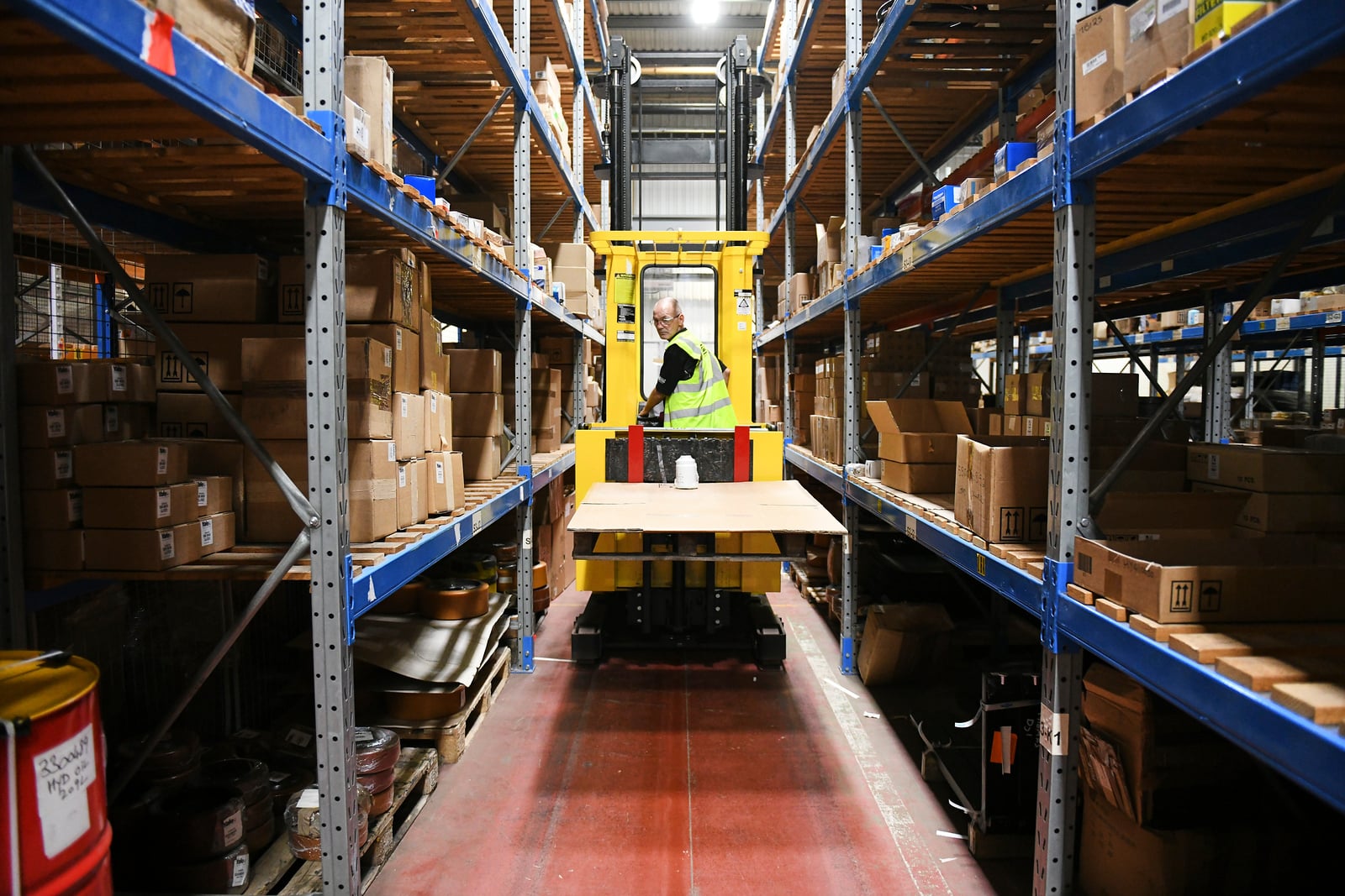 Operator uses a VNA truck within a manufacturing operation